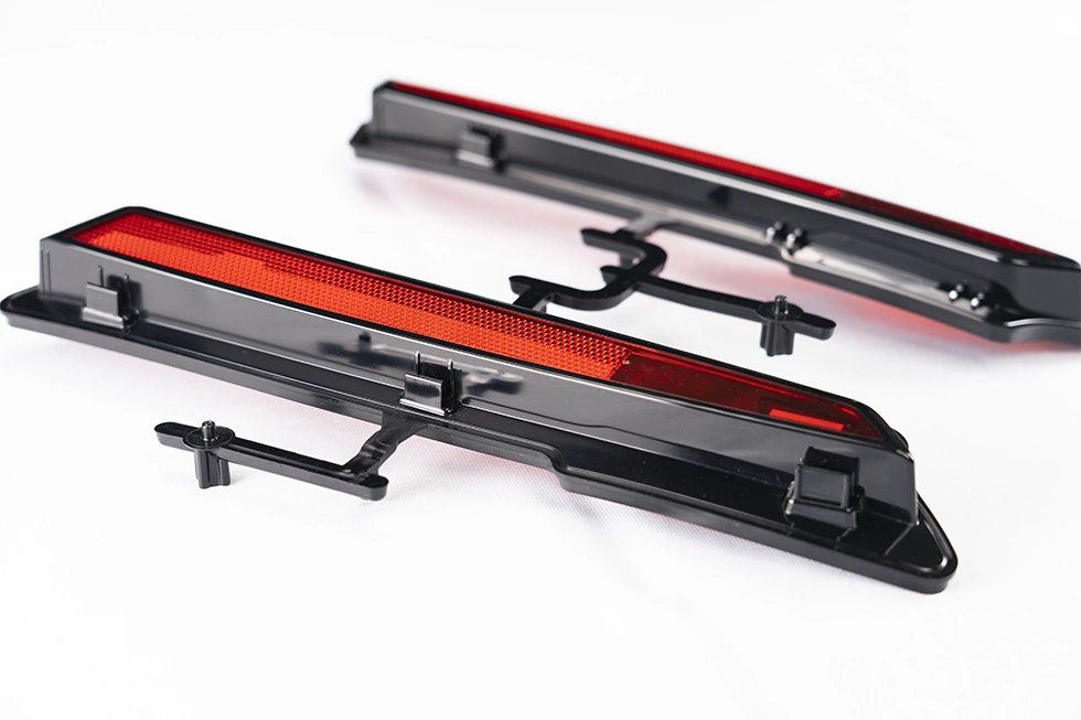 two shot molded automotive headlight parts